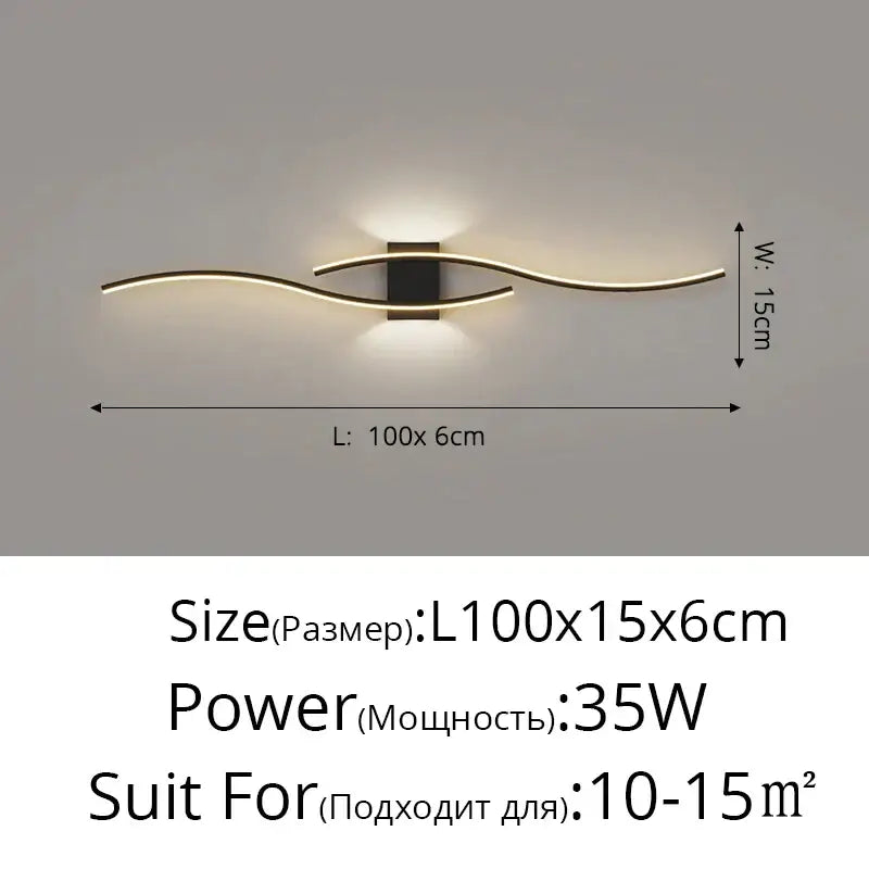 Modern gold curved led wall lamp with sleek gold-toned metal arms and black housing for bedroom ambient light