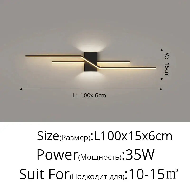 Modern gold curved led wall lamp with black and gold metallic arms emitting warm ambient light for bedroom use