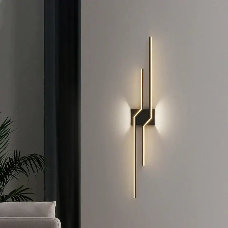 Modern gold curved led wall lamp with sleek vertical bars and black base for ambient bedroom lighting wall lamp