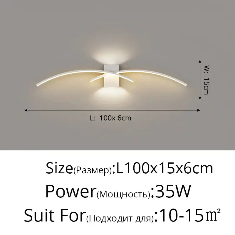Modern gold curved led wall lamp with sleek white led wall sconce arms emitting warm ambient light for bedroom