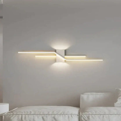 Modern white led wall lamp with sleek angular design and warm ambient lighting for bedroom decor