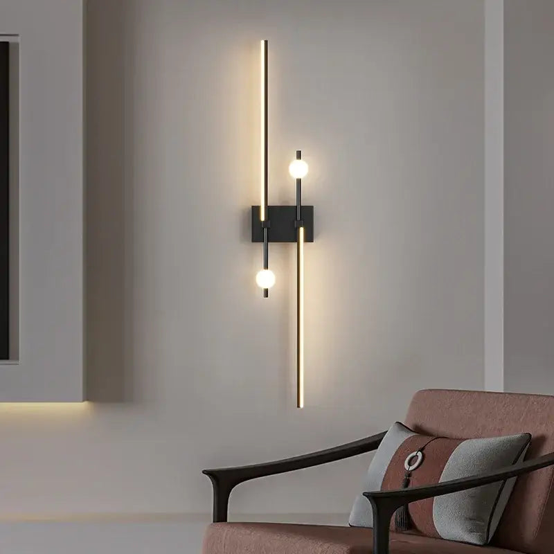 Modern black wall lamp with two vertical gold rods and three glowing spherical bulbs decorbites led wall lamp for living room
