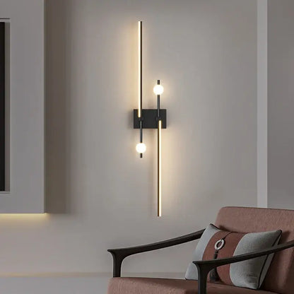 Modern black wall lamp with two vertical gold rods and three glowing spherical bulbs decorbites led wall lamp for living room