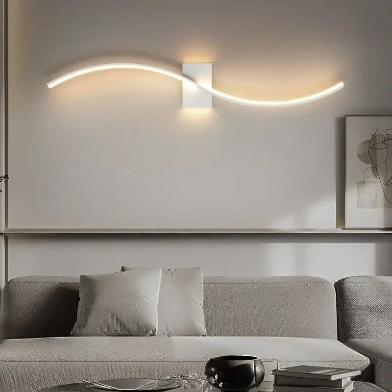 Modern gold curved led wall lamp with sleek white led wall sconce design emitting warm light for living room decorbites led wall
