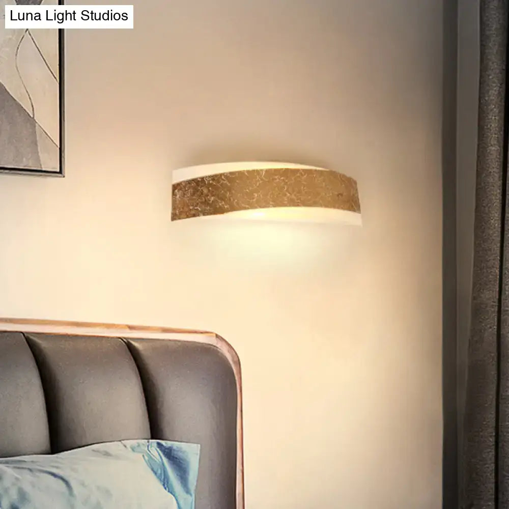 Modern gold curved led wall lamp with a metallic band and white diffuser for stylish living room wall mount lighting