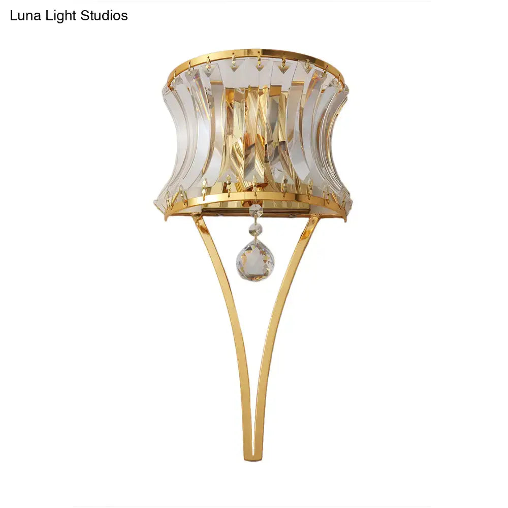 Elegant modern gold curved wall light featuring clear crystal prism shade and dangling teardrop crystal pendant for bedroom