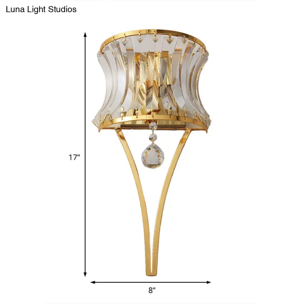 Modern gold curved wall light with clear crystal prism shade and dangling teardrop crystal pendant for bedroom use