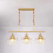 Gold-toned DecorBites™ crystal teardrop island pendant light with gold cylinder and three ornate crystal pendant heads