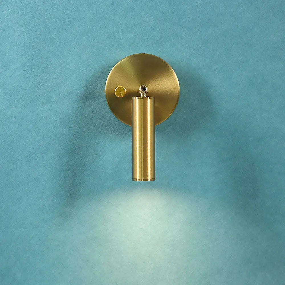 Modern gold cylindrical led wall lamp with circular backplate and knob switch ideal as decorbites led wall lamp