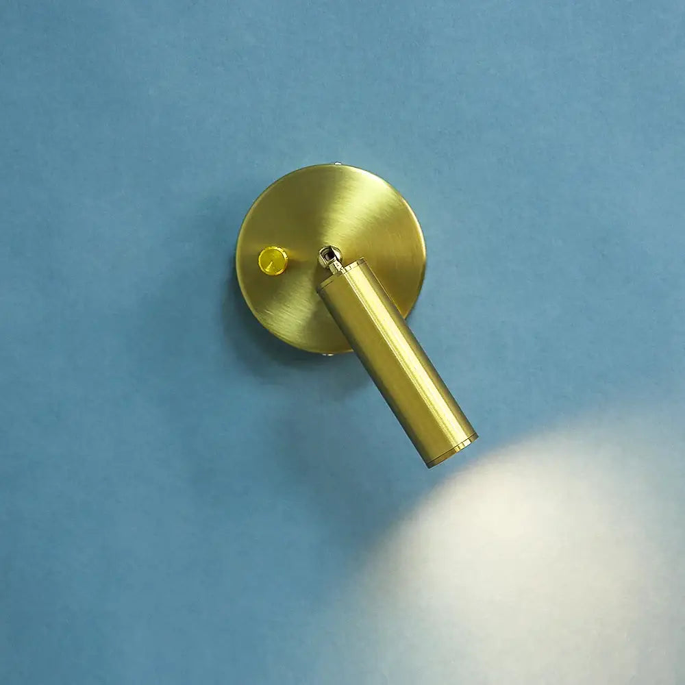 Modern gold cylindrical led wall lamp with knob switch mounted on wall ideal for bedroom decorbites led wall lamp