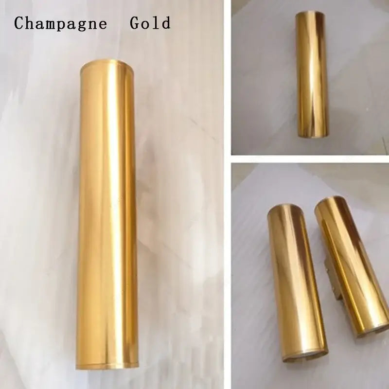 Modern champagne gold cylindrical metal wall sconce light fixture for living room interior lighting