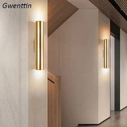 Modern gold cylindrical wall sconce light fixture with sleek design for living room wall sconce lighting