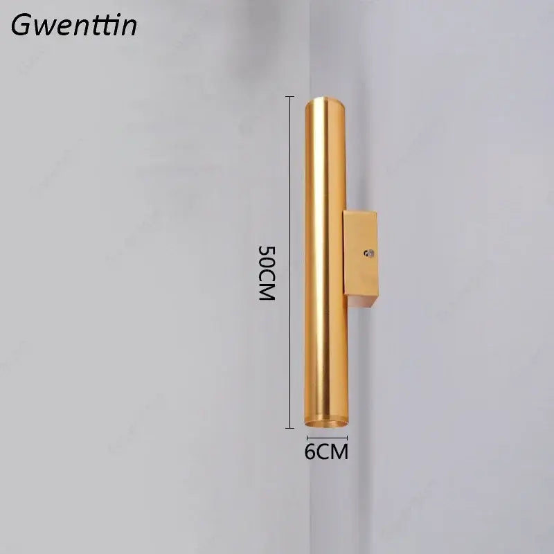 Modern gold cylindrical wall sconce light fixture with sleek metallic finish and rectangular mounting bracket for living room