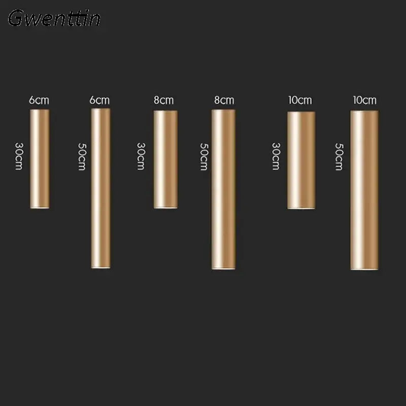 Modern gold cylindrical metal wall sconce light fixture featuring rods in various lengths and diameters for living room