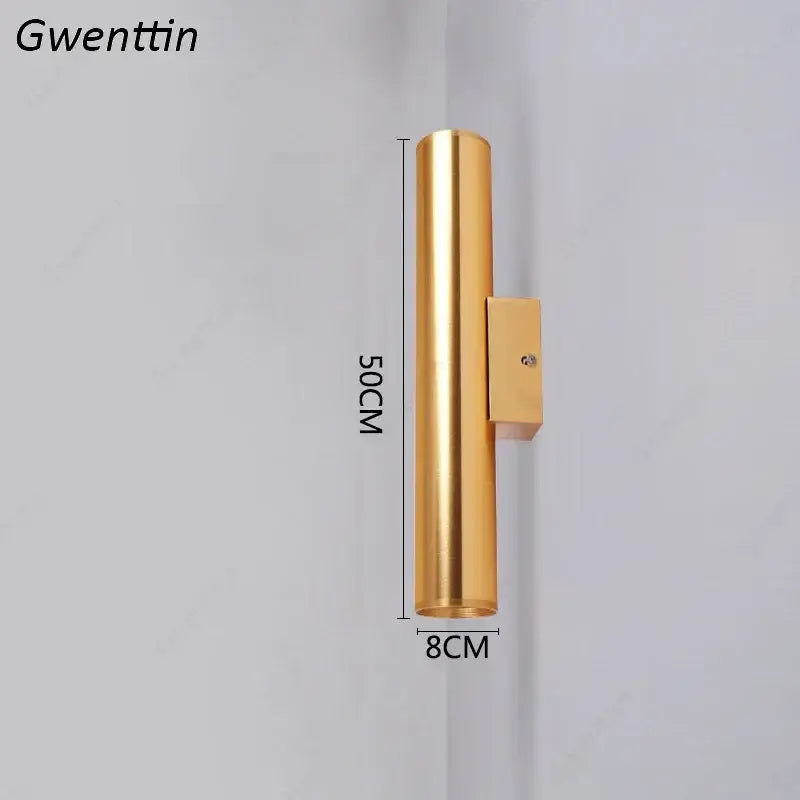 Modern gold cylindrical wall sconce light fixture with sleek metallic finish and rectangular mounting bracket for living room