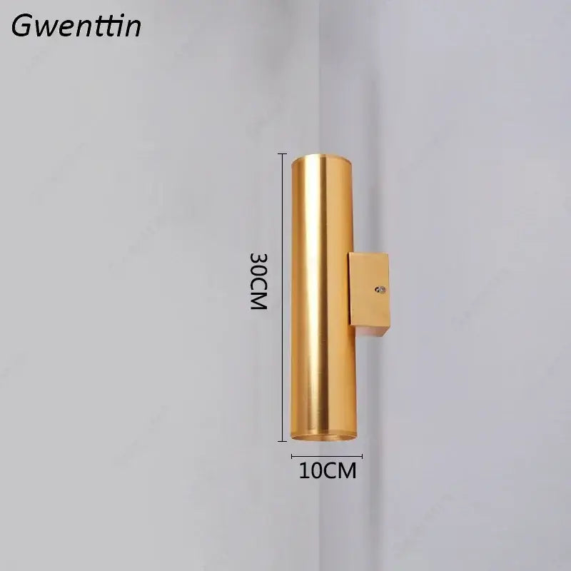 Modern gold cylindrical wall sconce light fixture with sleek metallic finish and rectangular mounting bracket for living room
