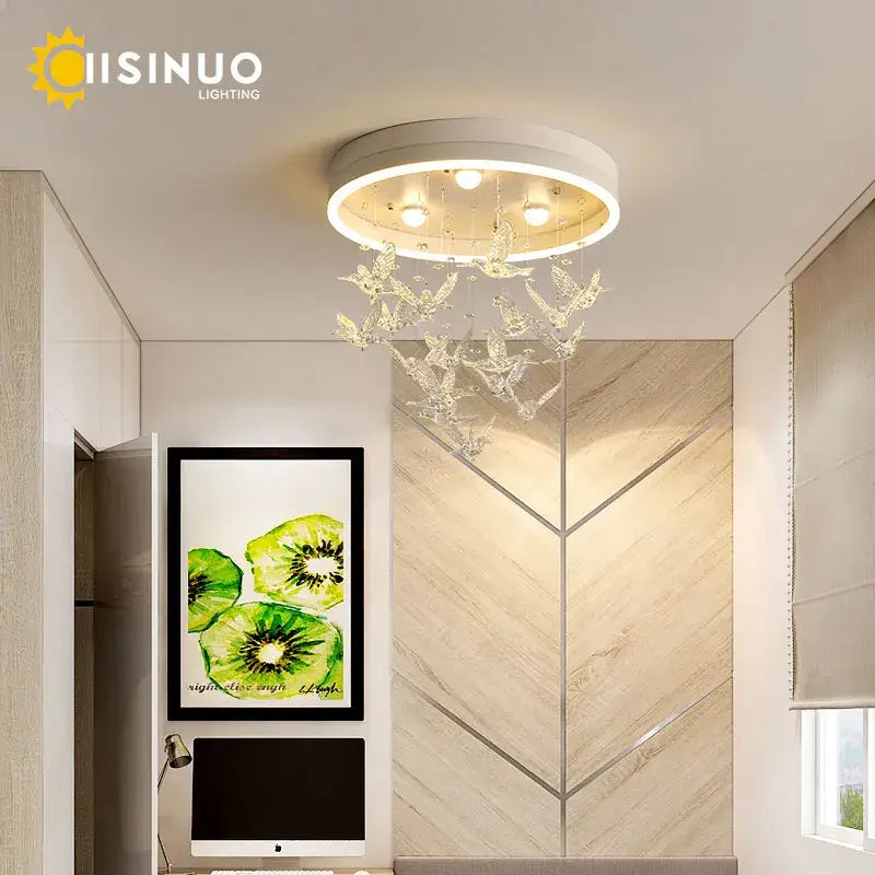 White circular ceiling light featuring crystal butterfly decorations in modern gold dancing girl led chandelier design