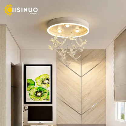 White circular ceiling light featuring crystal butterfly decorations in modern gold dancing girl led chandelier design