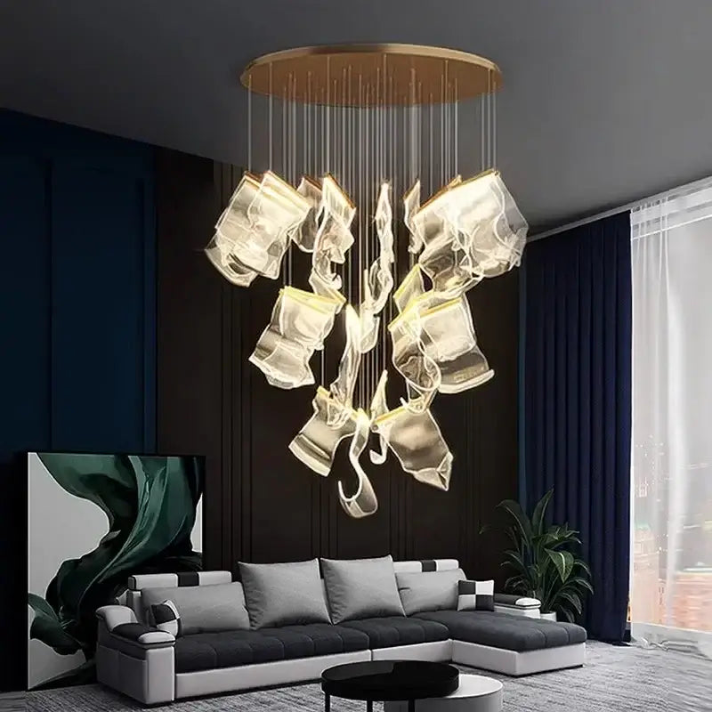Modern gold decorbites acrylic leaf chandelier with a circular base and cascading translucent glass for dining room lighting