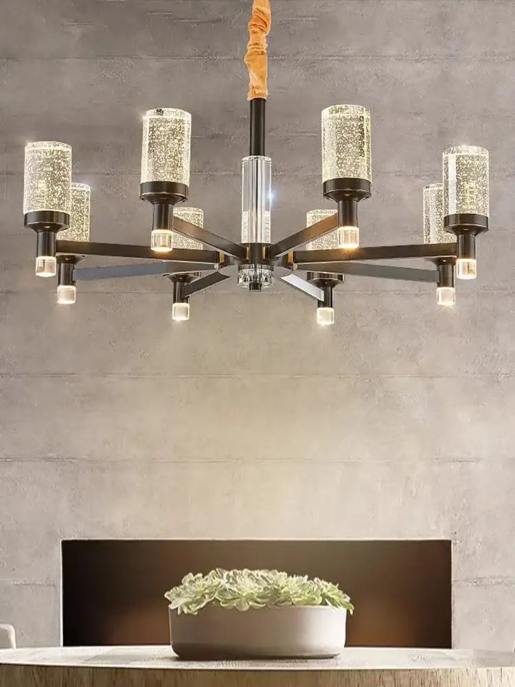 Modern gold decorbites bubble crystal chandelier with dark metal frame and cylindrical glass shades for living room lighting