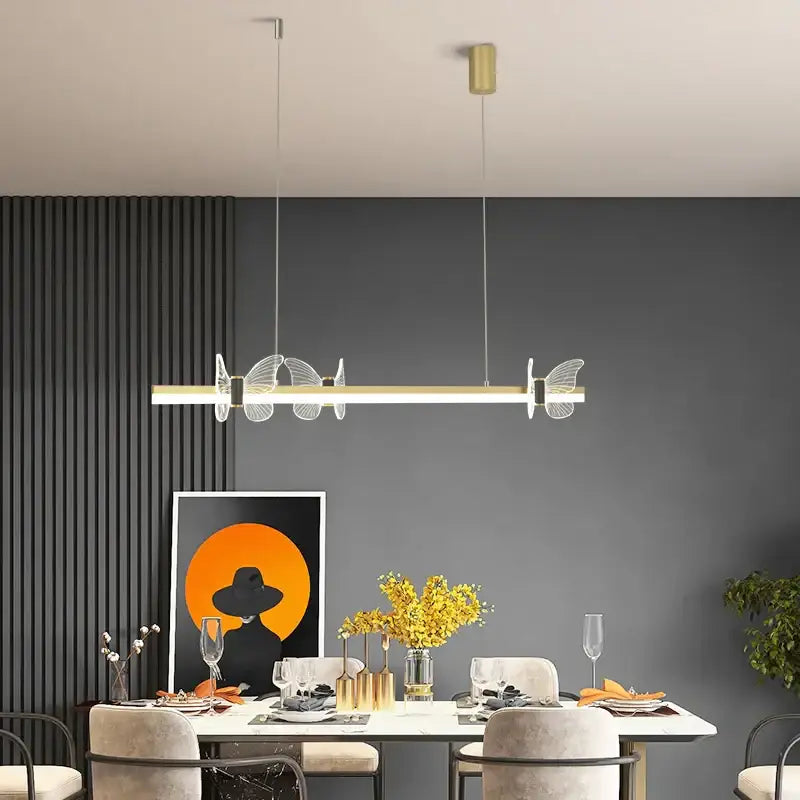 Modern gold decorbites butterfly flower chandelier with clear acrylic wings and sleek gold bar for dining room light