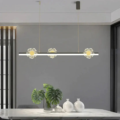 Modern gold decorbites butterfly flower chandelier featuring three illuminated white and gold floral pendants for dining room lighting