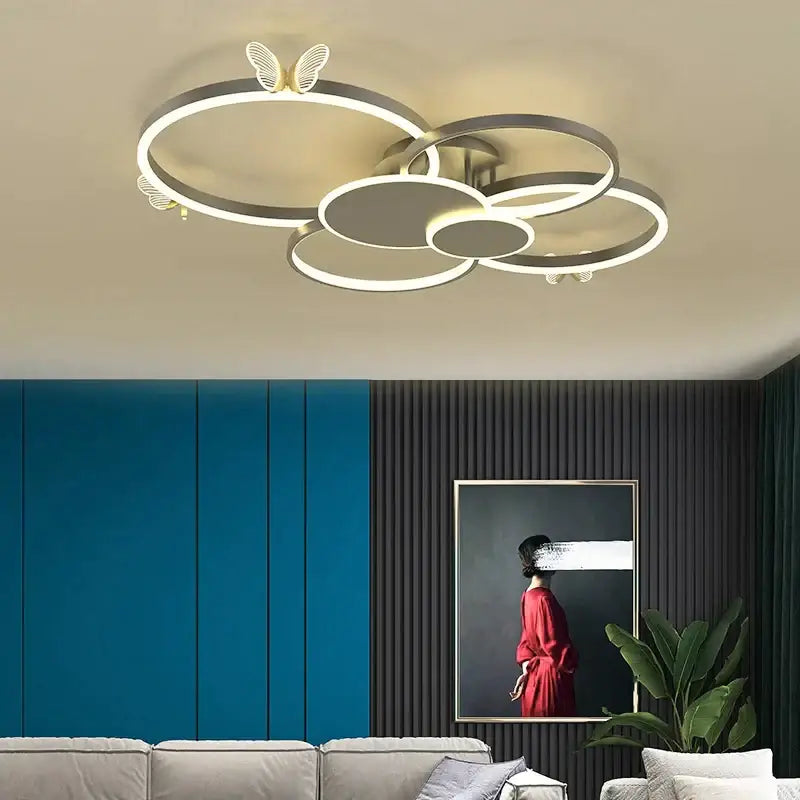Modern silver-toned led ceiling decorbites butterfly light fixture with interconnected rings for living room decor