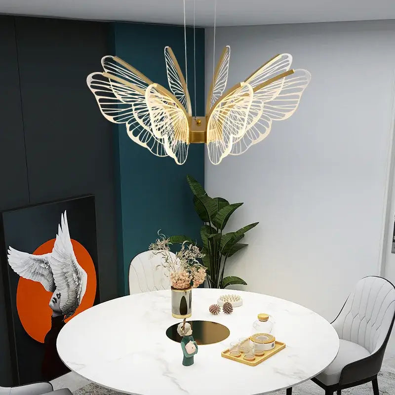 Gold-toned decorbites butterfly modern pendant light with intricate wireframe wings for dining room decor