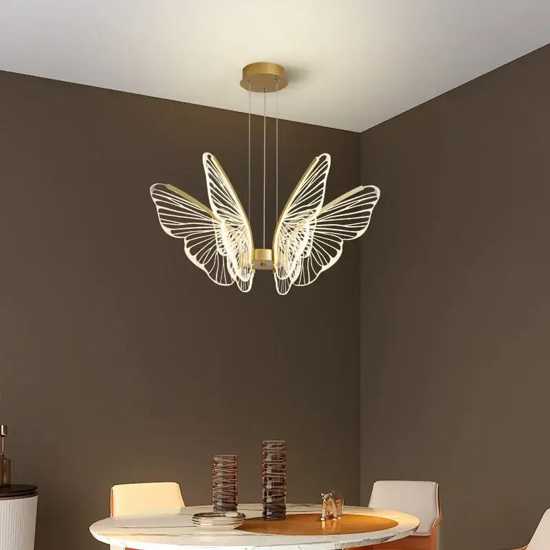 Gold-toned decorbites butterfly modern pendant light with intricate wireframe wings for dining room decor