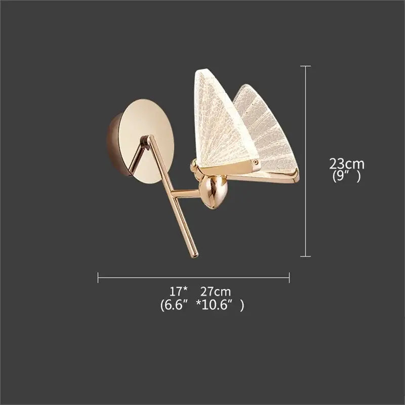 Modern gold decorbites butterfly wall sconce with translucent textured glass wings and sleek metallic frame for bedroom lighting
