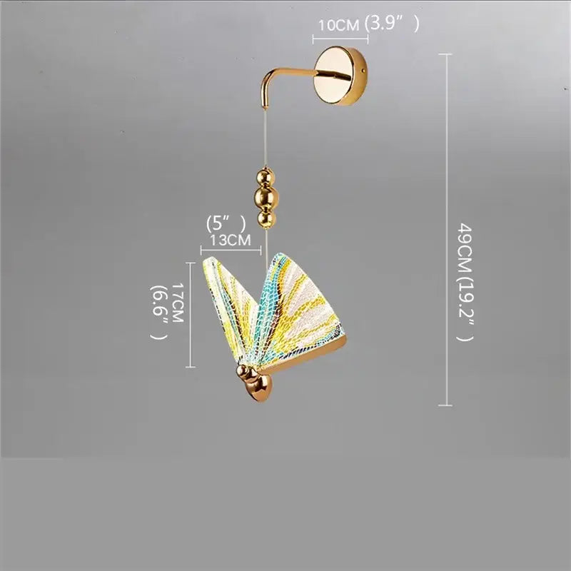 Modern gold decorbites butterfly wall sconce with iridescent yellow teal and white glass wings and gold metal accents
