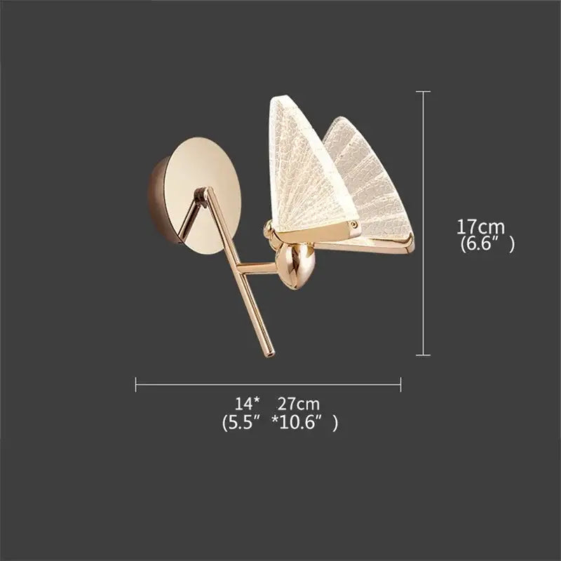 Modern gold decorbites butterfly wall sconce with translucent textured wings and sleek metallic frame for bedroom lighting