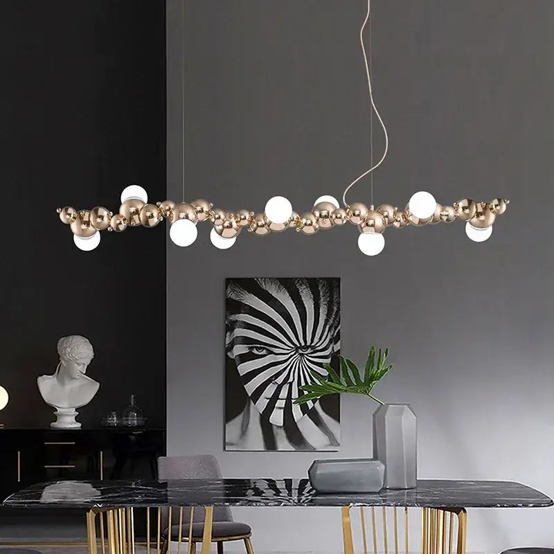 Modern gold decorbites caterpillar metal ball pendant light with polished spheres and glowing bulbs for dining room lighting
