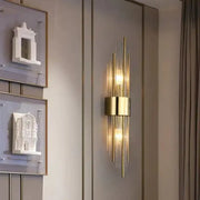 Modern gold decorbites clear crystal led wall lamp with vertical glass rods and central cylindrical base bedroom sconce