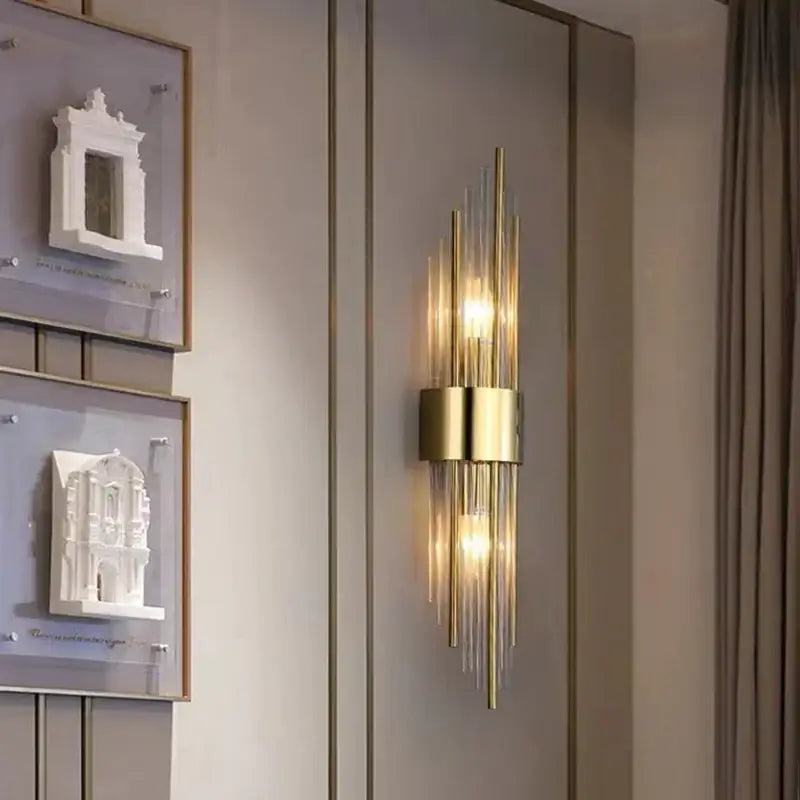 Modern gold decorbites clear crystal led wall lamp with vertical glass rods and central cylindrical base bedroom sconce