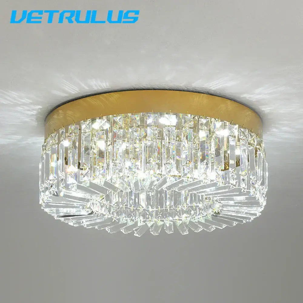 Modern gold decorbites crystal ceiling chandelier with gold-toned metal frame and faceted prisms for dining room lighting