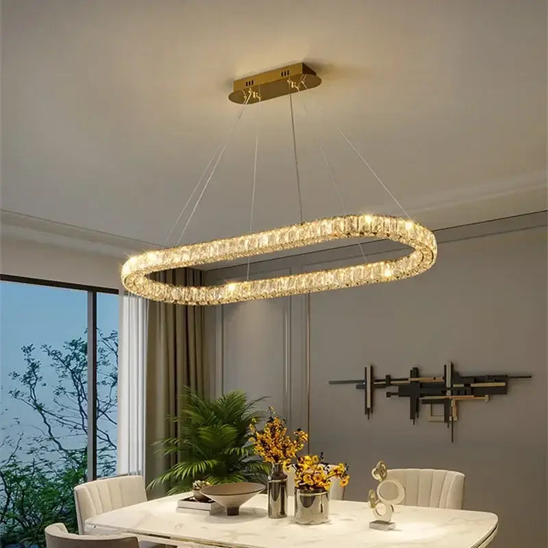 Modern gold decorbites crystal ceiling chandelier with gold-toned oval frame and sparkling crystal design for living room light