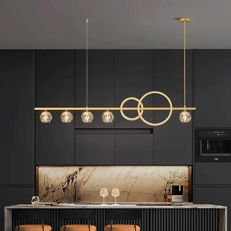 Modern gold decorbites crystal chandelier pendant light with five crystal globe bulbs and intersecting circular design