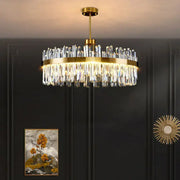 Modern gold decorbites crystal chandelier with clear faceted prisms in cascading tiers for living room and dining room