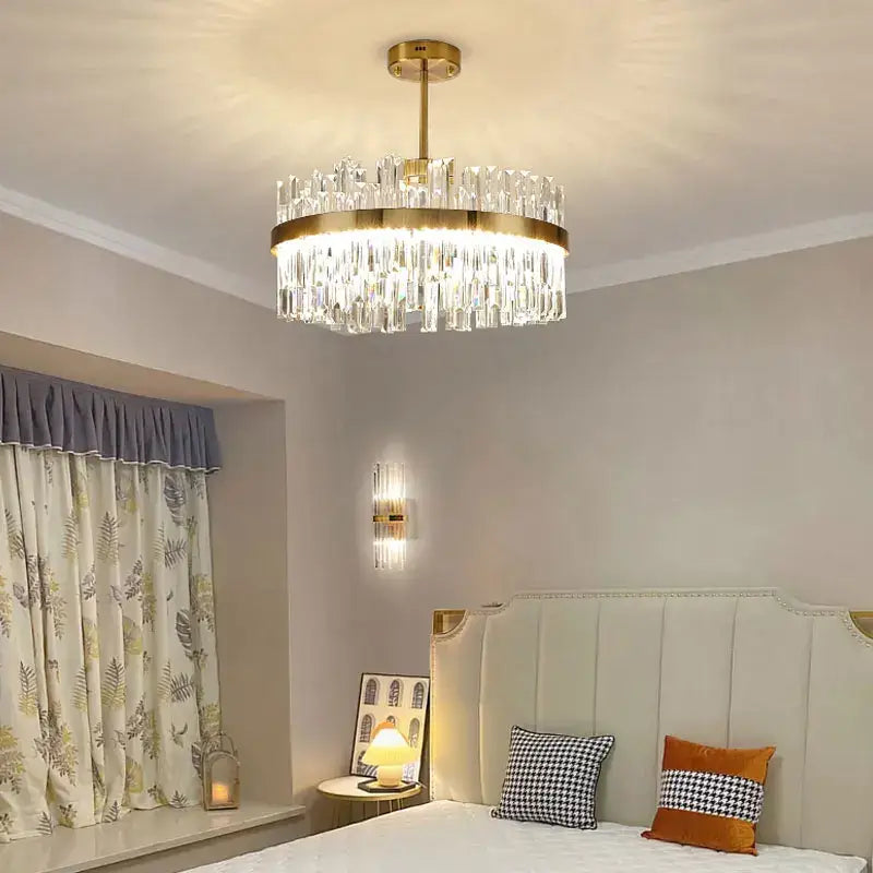 Modern gold decorbites crystal chandelier with clear glass prisms and gold metal frame for living room or dining room