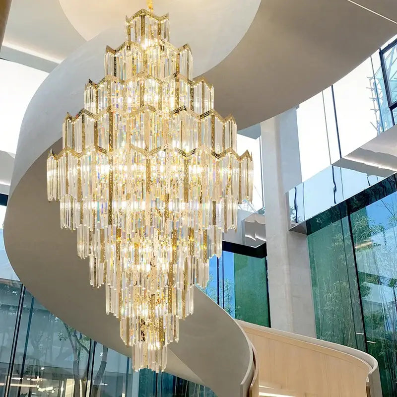 Modern gold decorbites crystal chandelier with cascading clear crystal prisms and gold-toned metal frames for living room loft