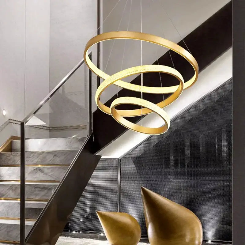 Modern gold decorbites crystal chandelier with golden spiral ring design for staircase and living room lighting