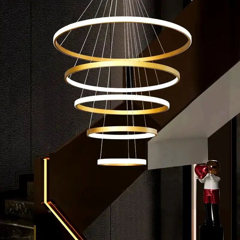Modern gold decorbites crystal chandelier with spiral alternating gold and white rings for staircase living room light