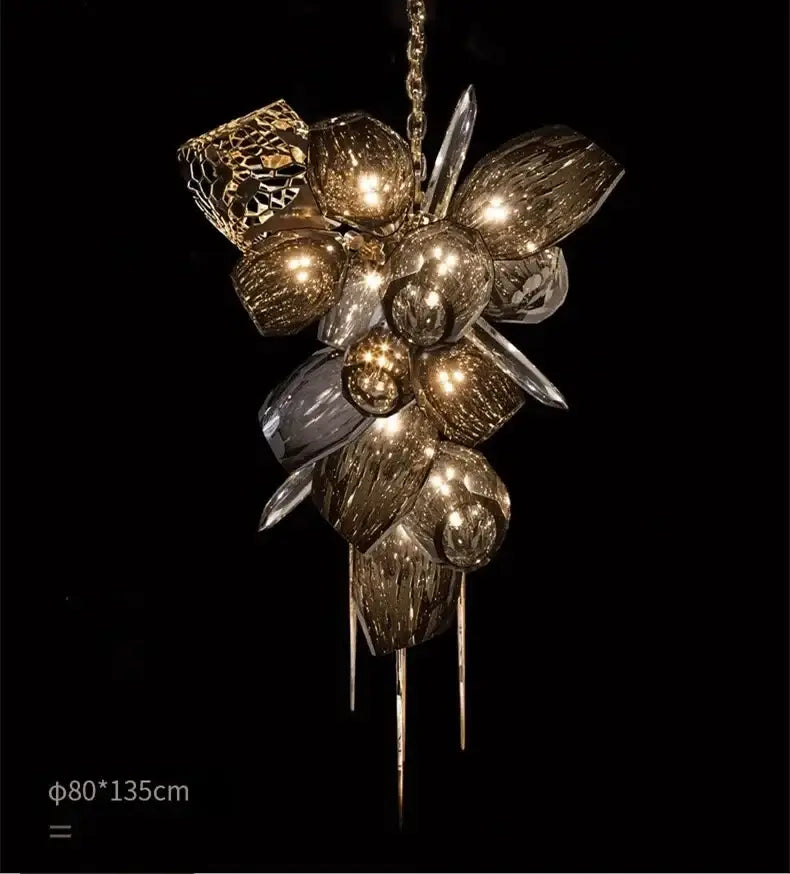 Gold-toned decorbites crystal duplex chandelier featuring textured glass orbs and crystal shards for living room lighting