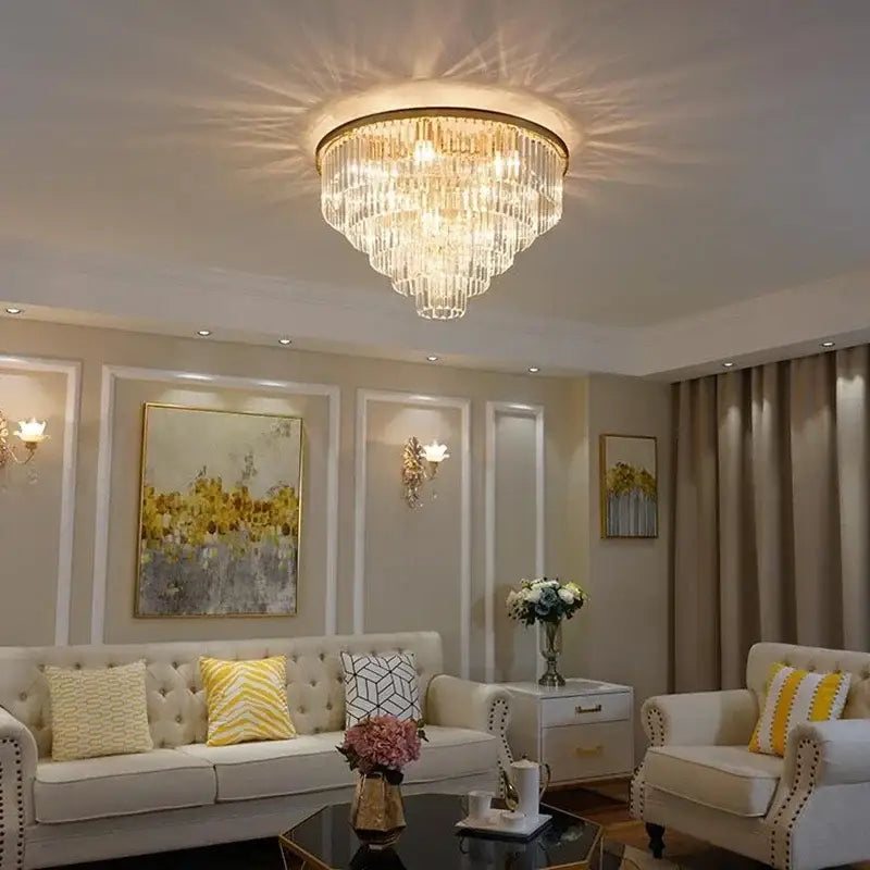 Modern gold decorbites crystal flush ceiling light with multi-tiered crystal prisms emitting warm light for bedroom
