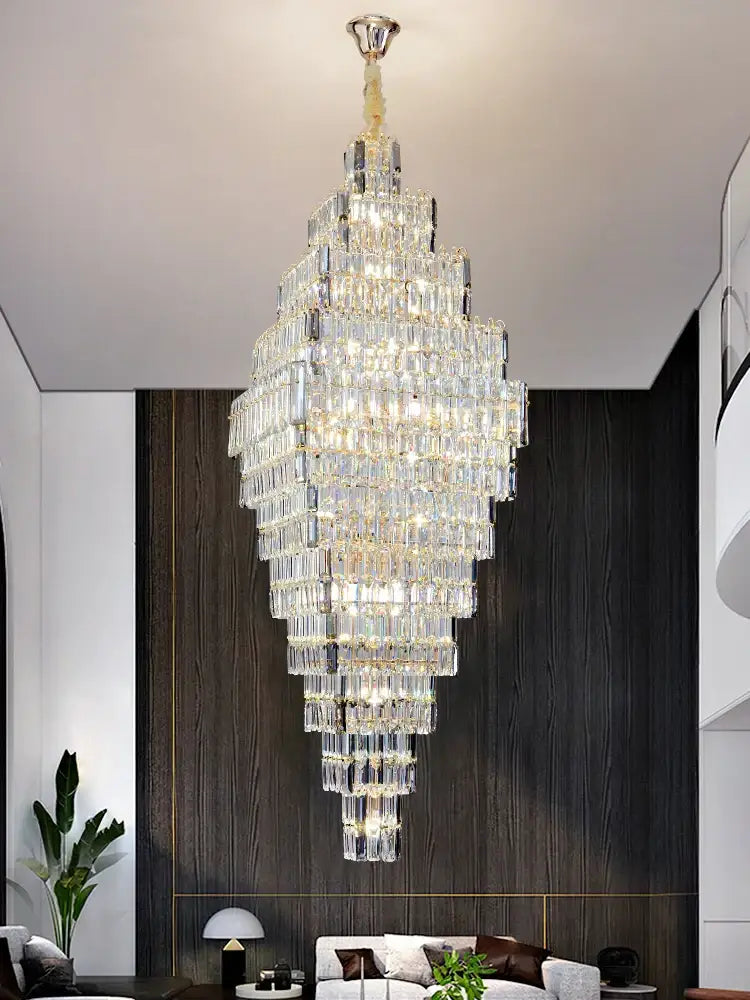 Modern gold decorbites crystal large chandelier with a gold-toned frame and cascading prisms for staircase pendant light