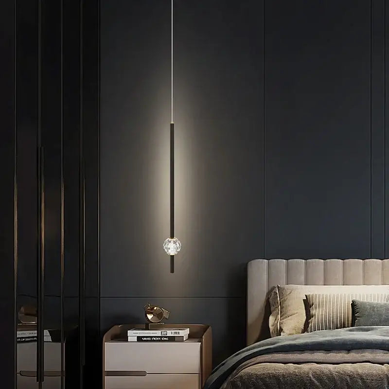 A sleek black pendant light with a crystal globe base in modern gold decorbites crystal led chandelier style