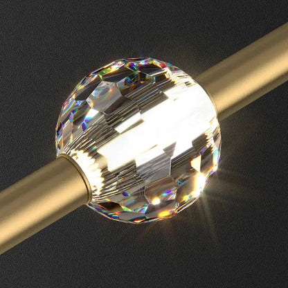 A decorbites crystal led bedroom pendant light with a faceted clear crystal ball and rainbow reflections