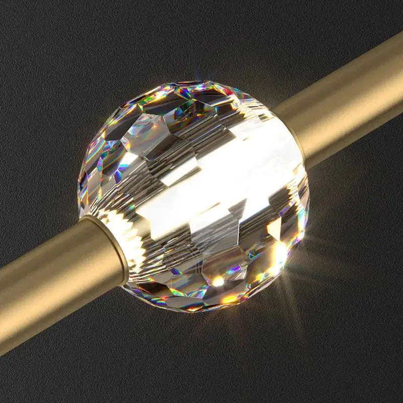 A decorbites crystal led bedroom pendant light with a faceted clear crystal ball and rainbow reflections