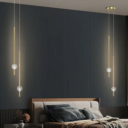 Modern gold decorbites crystal led chandelier features gold-toned pendant lights with crystal spheres for bedroom decor